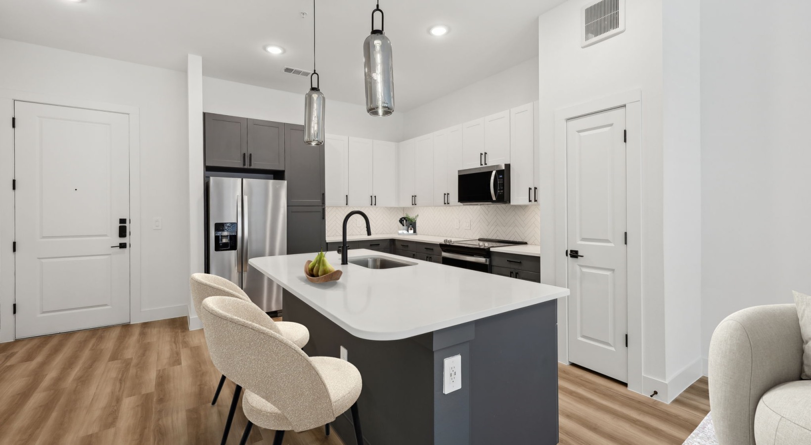 Kitchen with ample natural lighting and stainless appliances