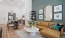 Spacious living room with hardwood style floor inside apartment homes at Copper Bishop Arts